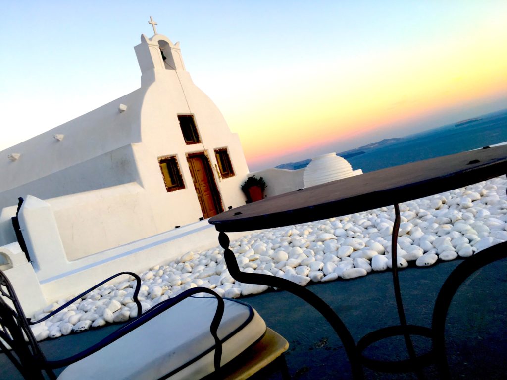 Sitting on a patio in Oia watching the Santorini sunset