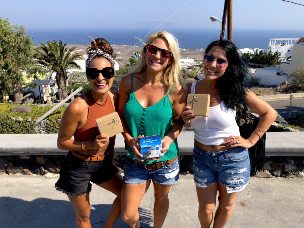 Girls with Santorini souvenirs & gifts from locals