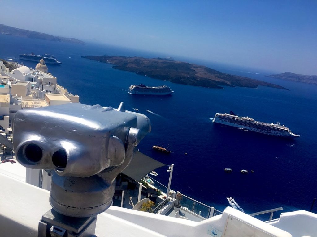 Cruise ship traffic on the shores of Oia in Santorini